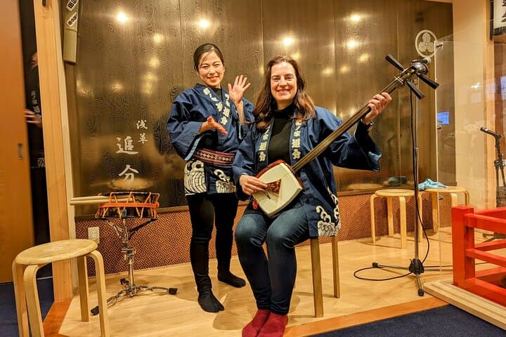 Tsugaru shamisen performance over traditional dinner — photo 5