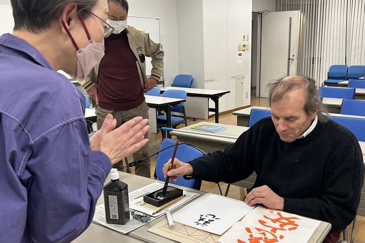 Calligraphy Experience in Tokyo Writing on Colored Paper — photo 1