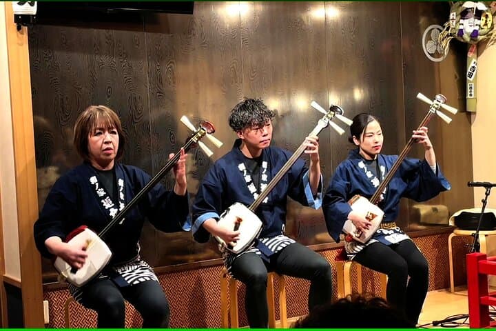 Tsugaru shamisen performance over traditional dinner — photo 2