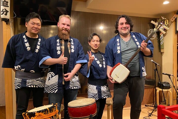 Tsugaru shamisen performance over traditional dinner — photo 7