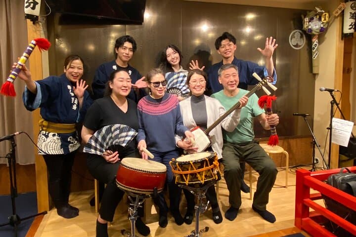 Tsugaru shamisen performance over traditional dinner — photo 8