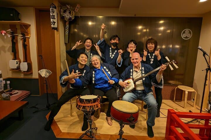 Tsugaru shamisen performance over traditional dinner — photo 10