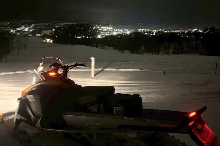 Sunset and Night Snowmobile Experience in Winter Sheep Farm